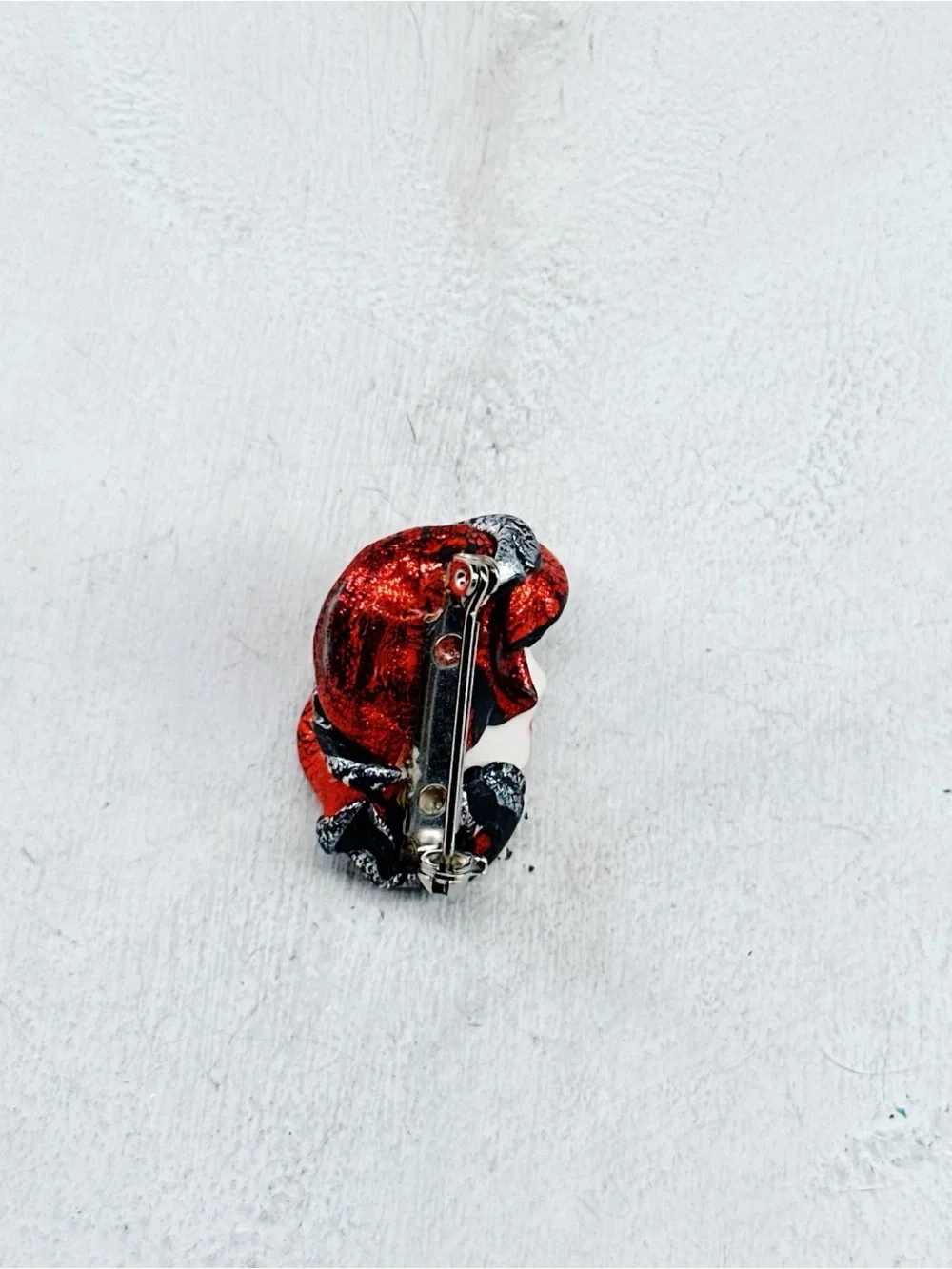 338u. Red Hat Clay Ladyface Brooch